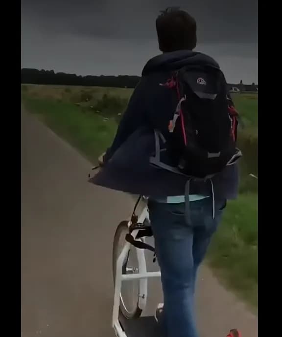 Rider on an electric walking bike along a country road